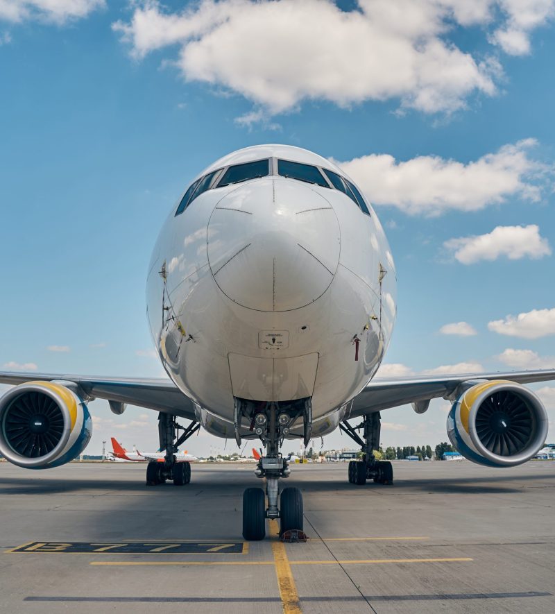 Front view of a modern large civil plane landed on the runway at the airdrome